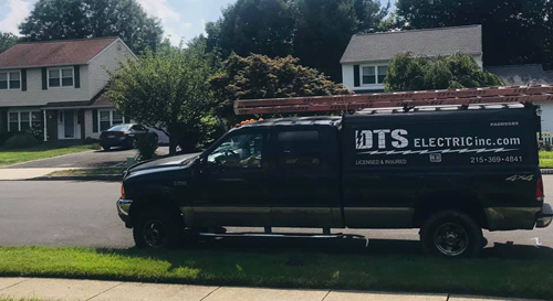 DTS Electric service truck in a residential neighborhood